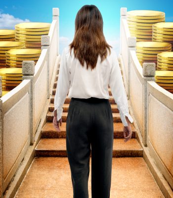 Asian businesswoman walking on the bridge with coins and blue sky background